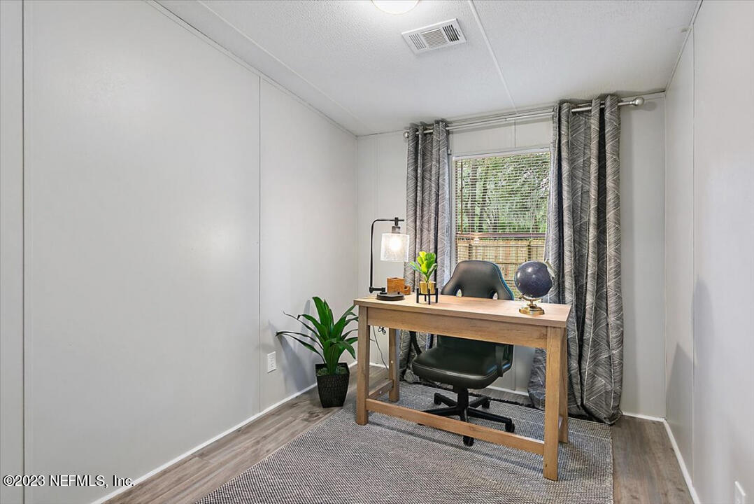 13712 Coman Road Jacksonville, FL 32218 - Photo 11 of 16 a view of workspace with a window