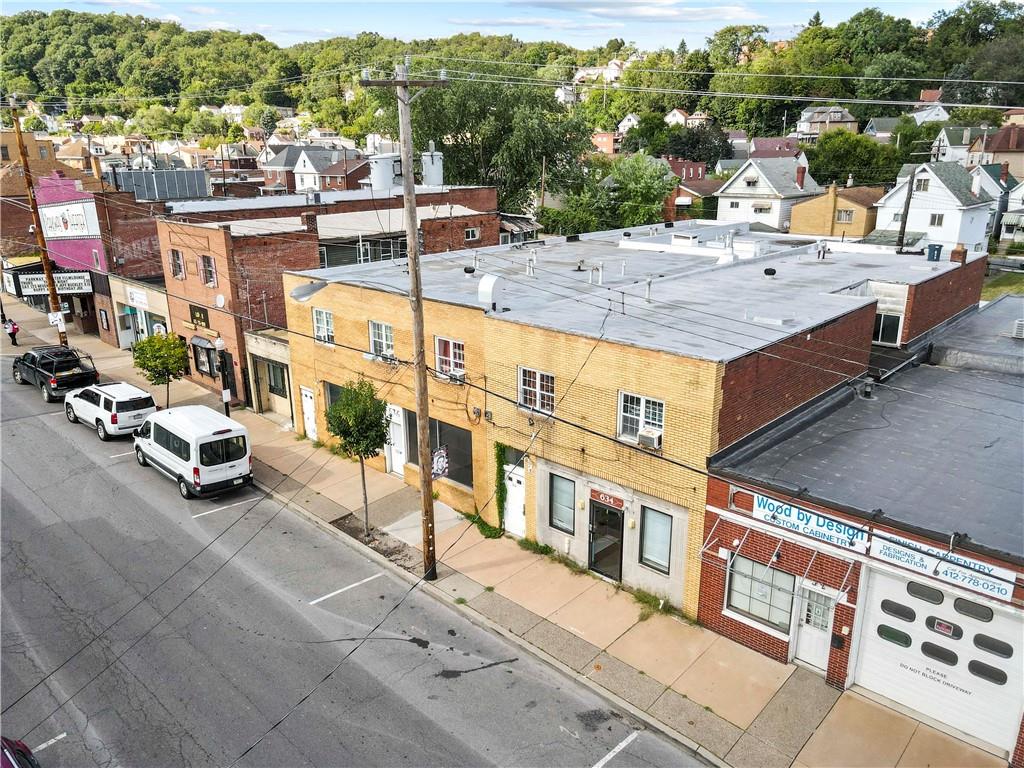 a view of a patio with swimming pool and sitting area