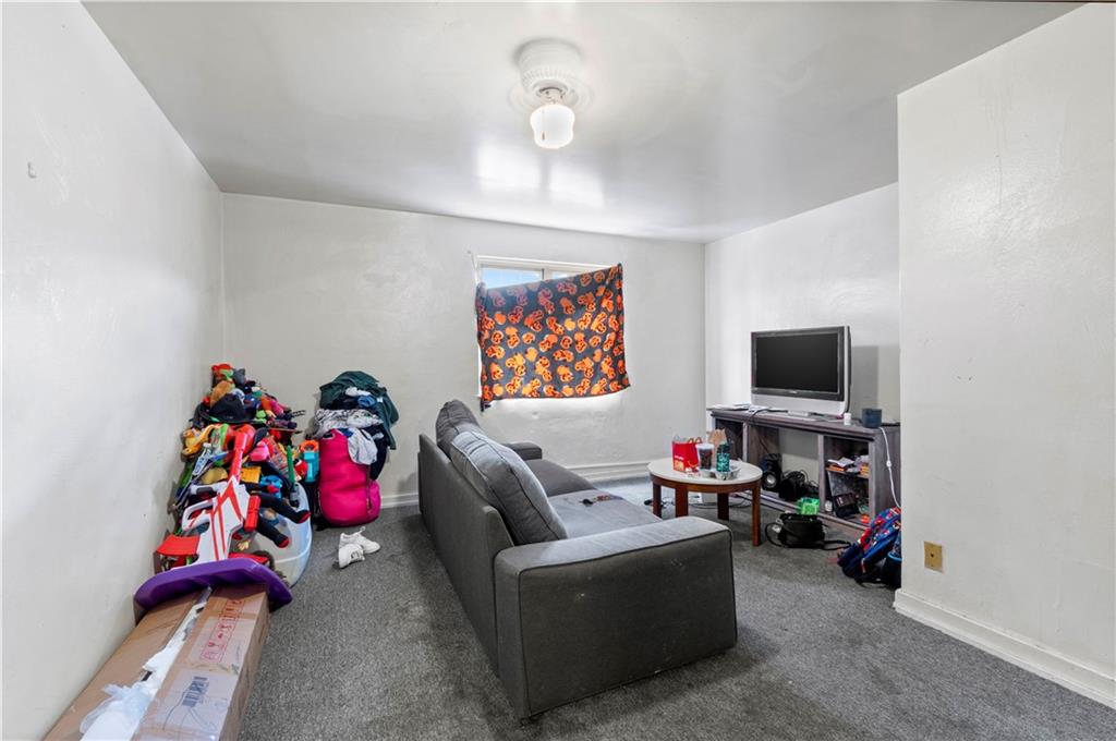 634 Broadway Avenue McKees Rocks, PA 15136 - Photo 15 of 40 a living room with furniture and a flat screen tv