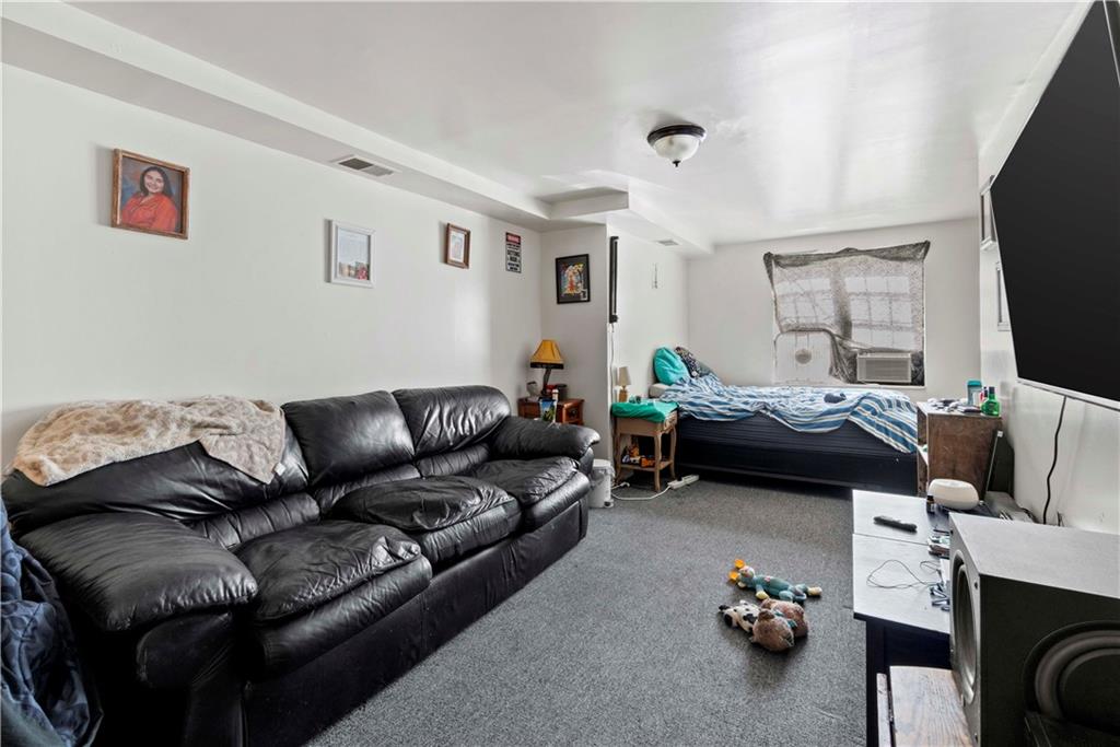 634 Broadway Avenue McKees Rocks, PA 15136 - Photo 24 of 40 a living room with furniture and a flat screen tv