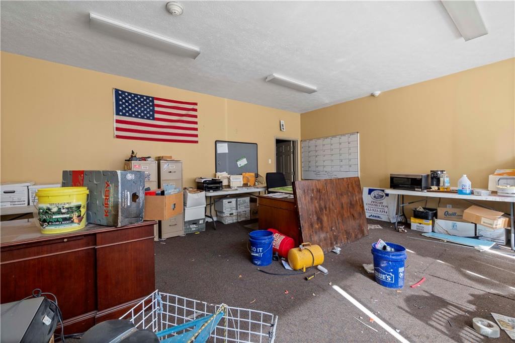 634 Broadway Avenue McKees Rocks, PA 15136 - Photo 25 of 40 a room with furniture and a wooden floor