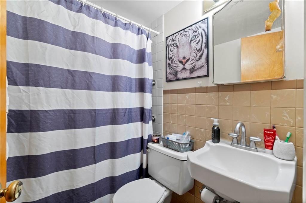 634 Broadway Avenue McKees Rocks, PA 15136 - Photo 26 of 40 a bathroom with a sink and a mirror