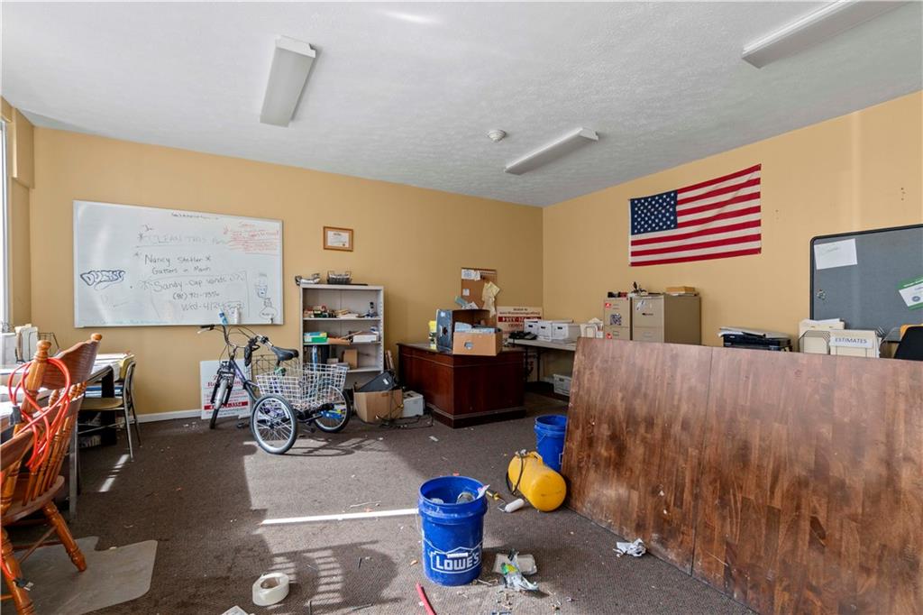 634 Broadway Avenue McKees Rocks, PA 15136 - Photo 34 of 40 a living room with furniture and a flat screen tv