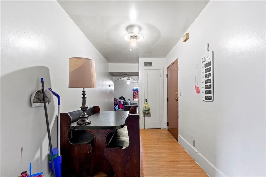 634 Broadway Avenue McKees Rocks, PA 15136 - Photo 10 of 40 a dining room with furniture and a wooden floor