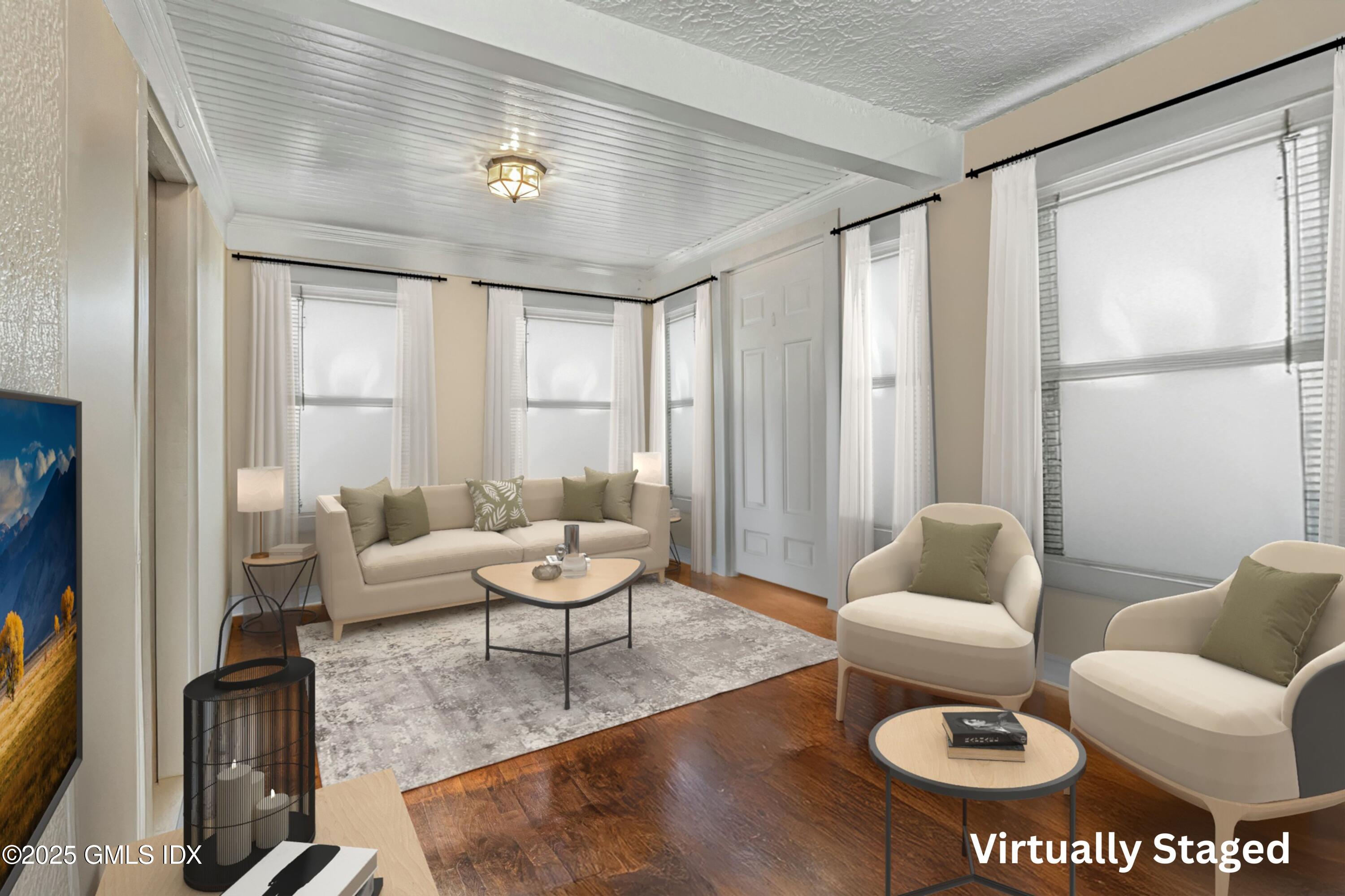 38 Alexander Street Greenwich, CT 06830 - Photo 12 of 36 a living room with furniture and a large window