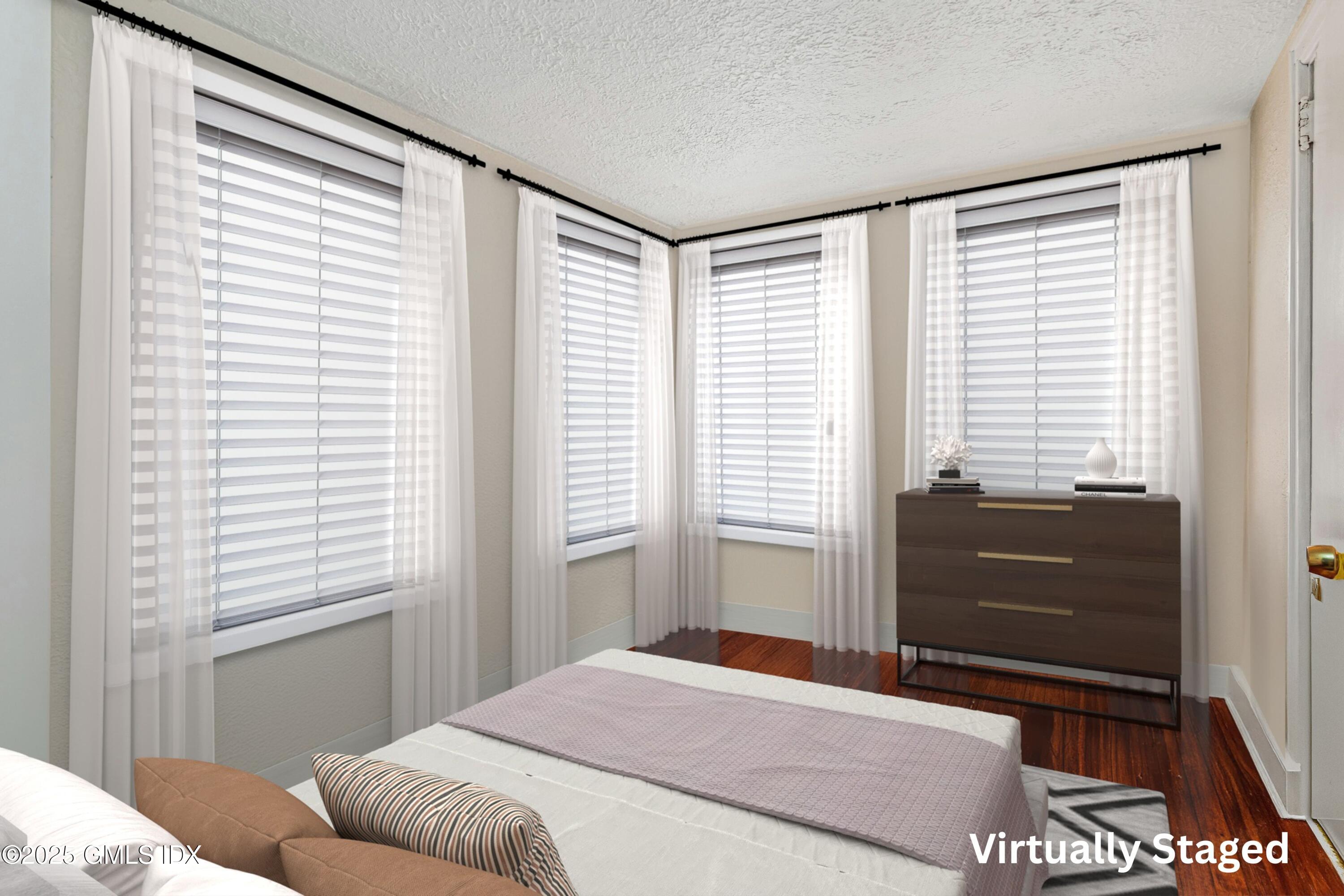 38 Alexander Street Greenwich, CT 06830 - Photo 14 of 36 a bedroom with a bed and a window