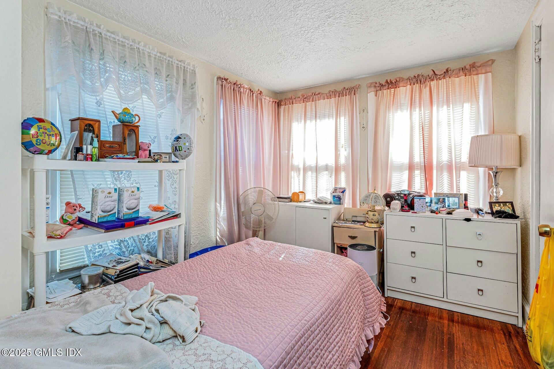 38 Alexander Street Greenwich, CT 06830 - Photo 15 of 36 a bedroom with a bed and a window