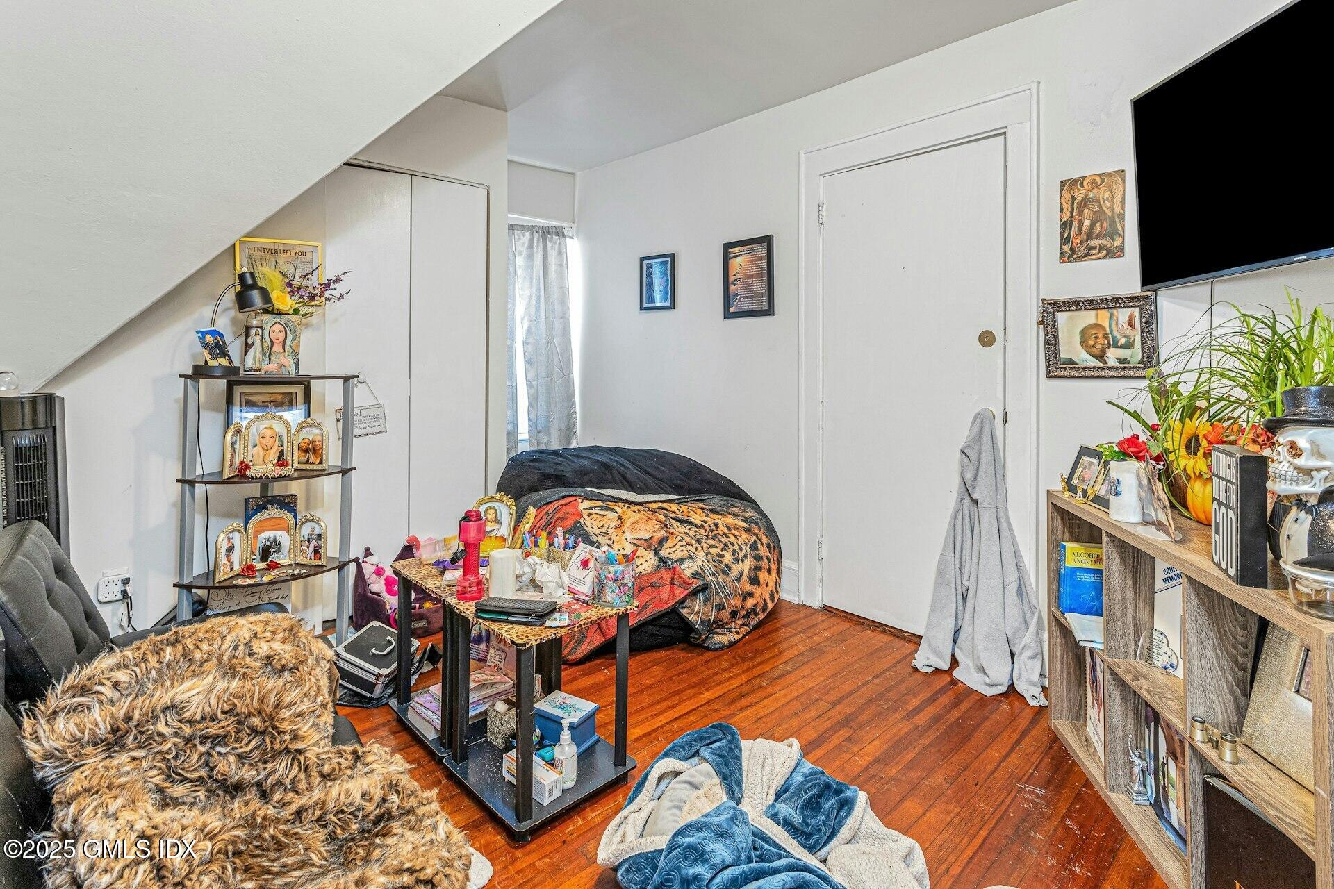 38 Alexander Street Greenwich, CT 06830 - Photo 25 of 36 a bedroom with furniture and a flat screen tv