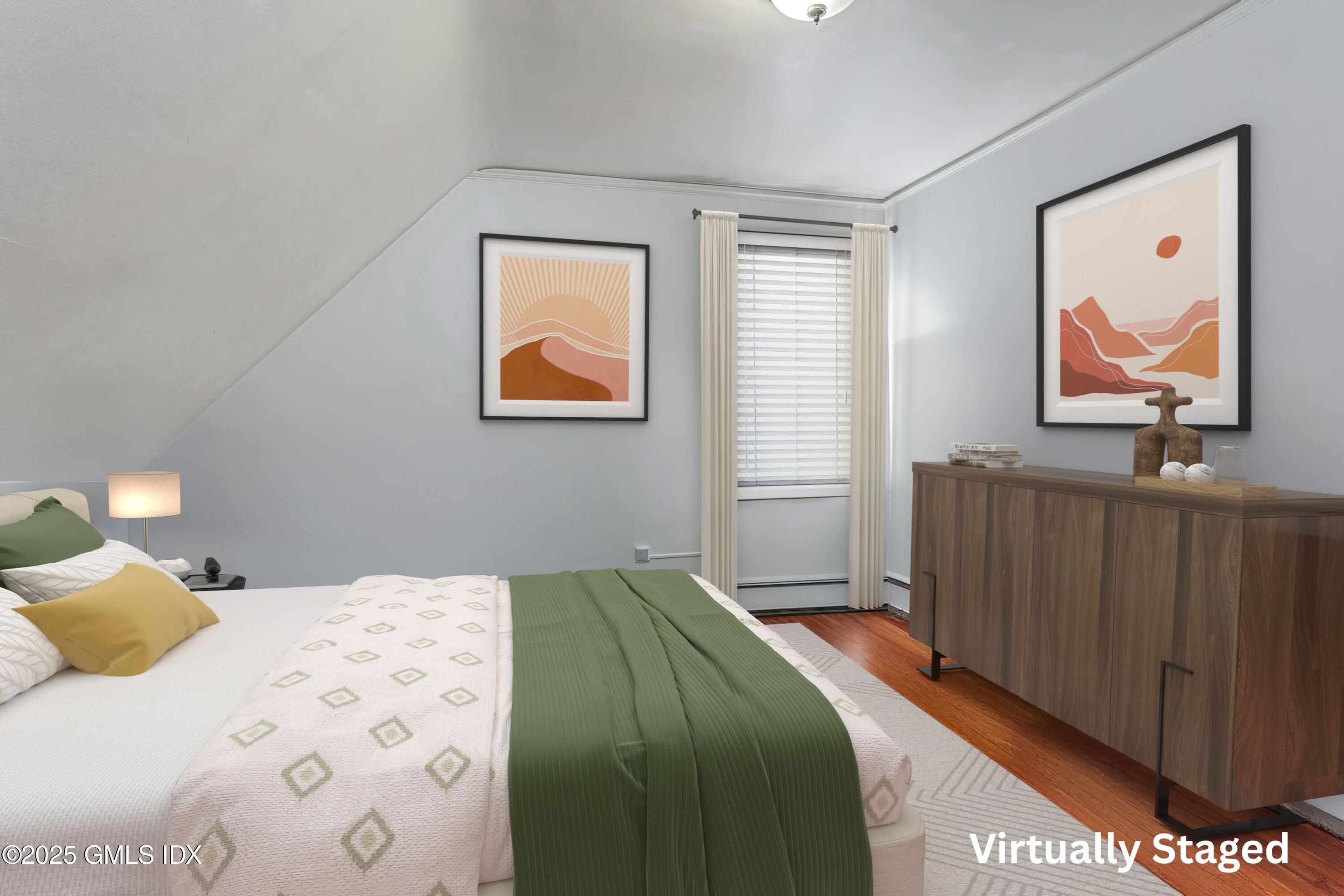 38 Alexander Street Greenwich, CT 06830 - Photo 26 of 36 a bedroom with a bed and a painting on the wall