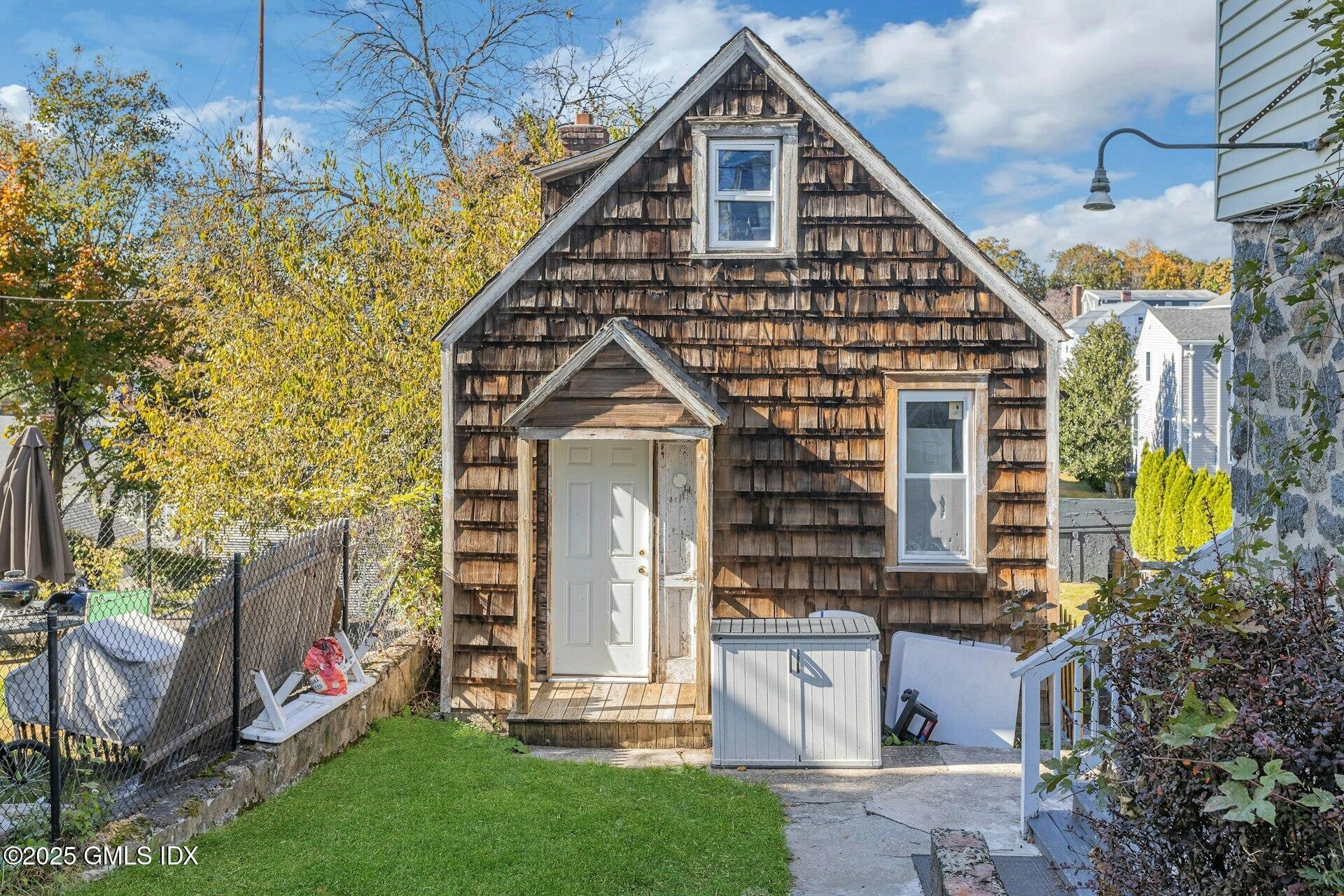 38 Alexander Street Greenwich, CT 06830 - Photo 31 of 36 a front view of a house with garden
