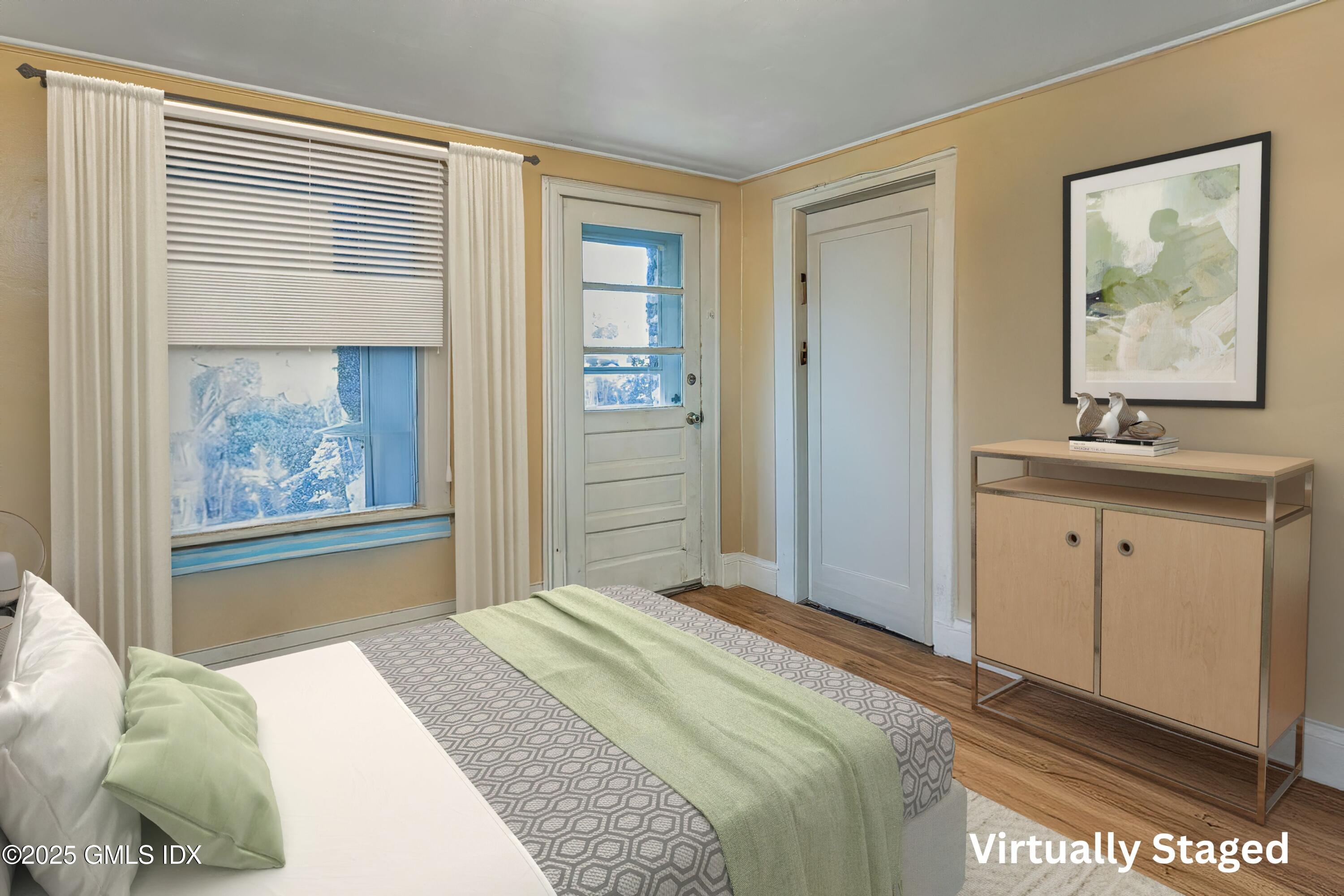 38 Alexander Street Greenwich, CT 06830 - Photo 4 of 36 a bedroom with a bed and a window