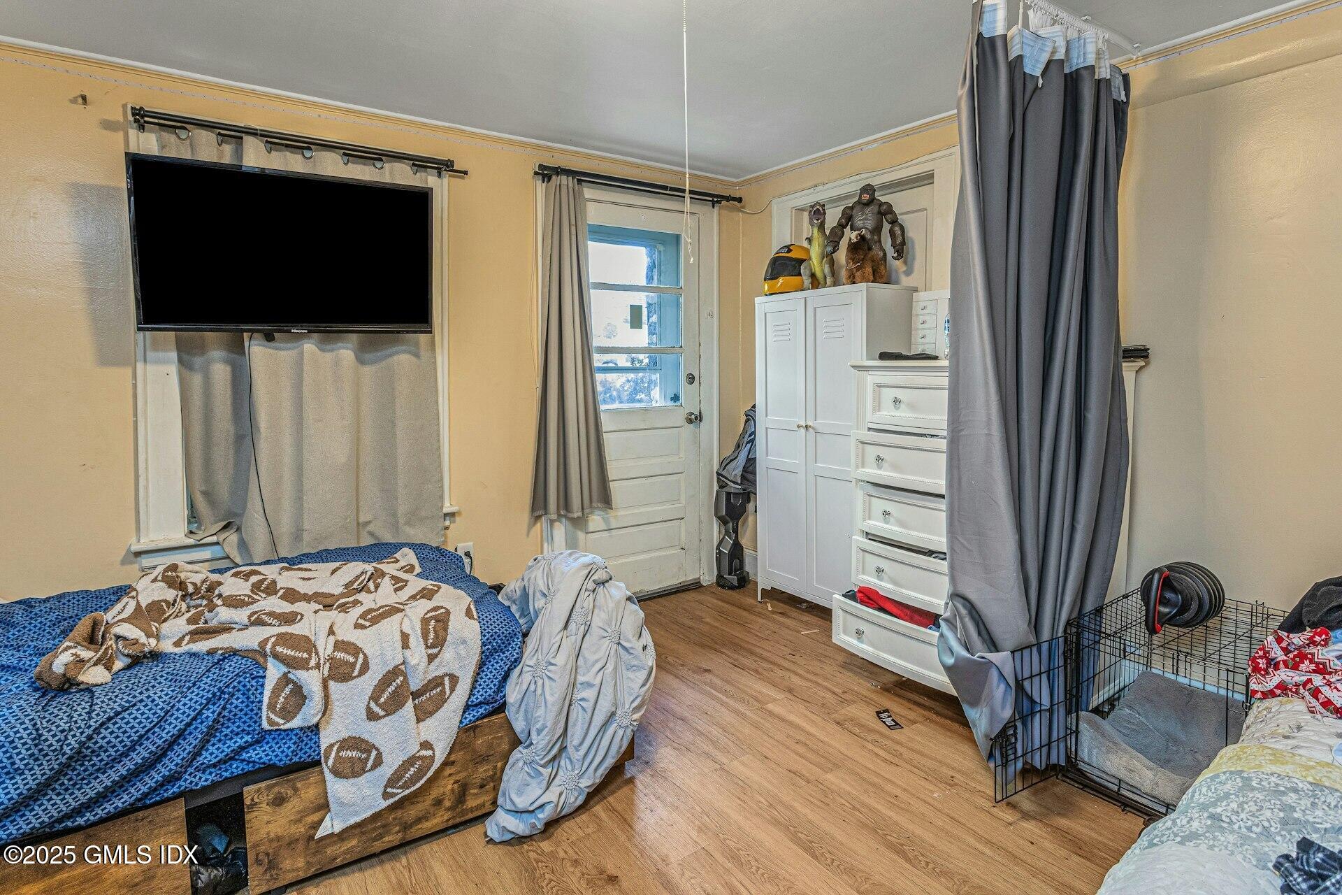 38 Alexander Street Greenwich, CT 06830 - Photo 5 of 36 a bedroom with a bed and a flat screen tv