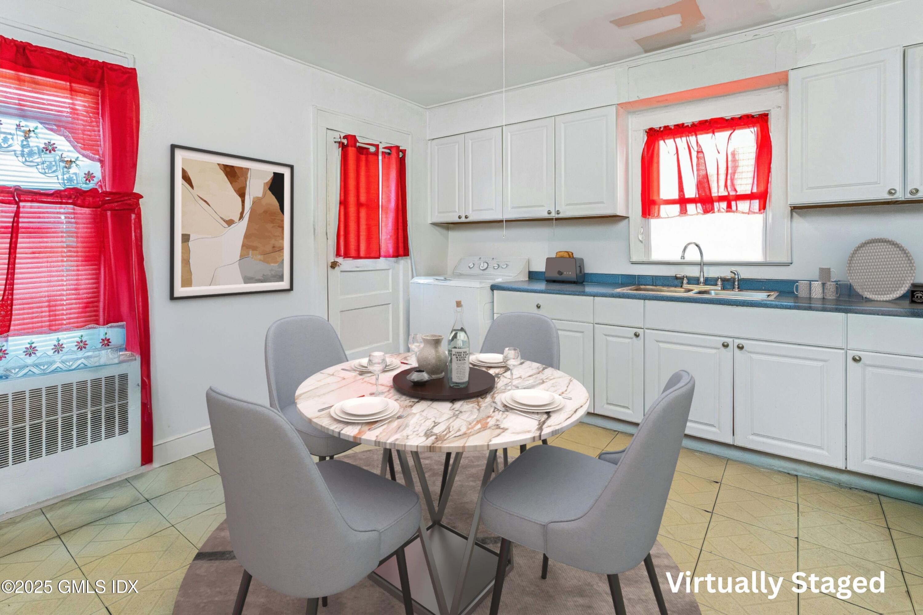 38 Alexander Street Greenwich, CT 06830 - Photo 8 of 36 a kitchen with a dining table and chairs