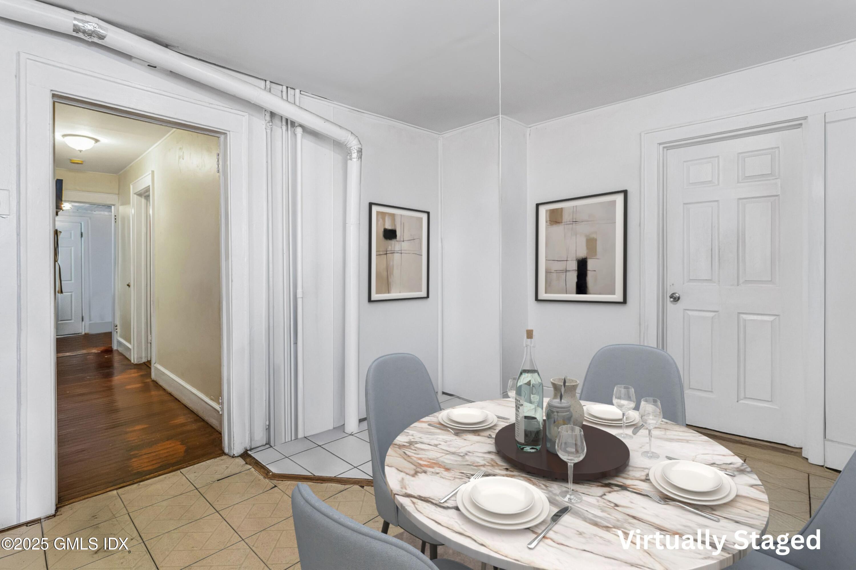 38 Alexander Street Greenwich, CT 06830 - Photo 10 of 36 a table room with stainless steel appliances