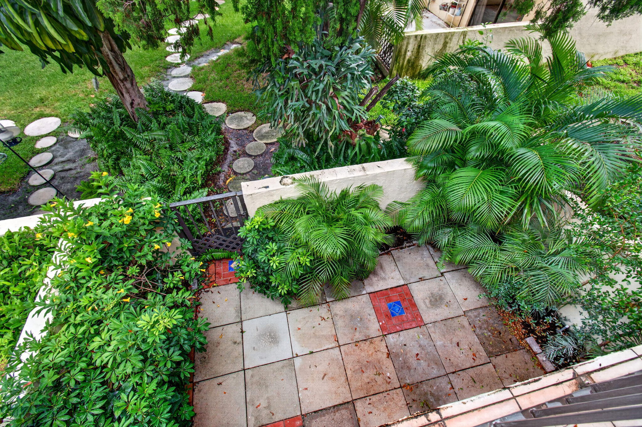 1330 Northwest 13th Street, Unit 12 Boca Raton, FL 33486 - Photo 42 of 52 a backyard of a house with lots of green space