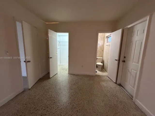 a view of empty room with entrance