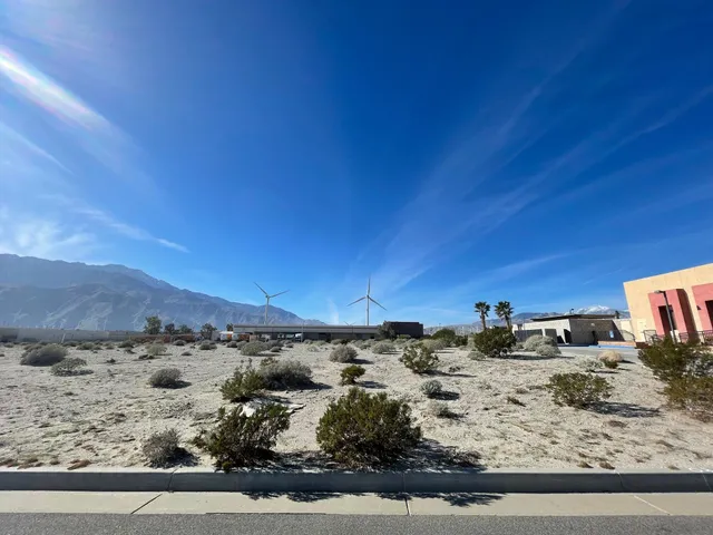 a view of a backyard with wooden fence