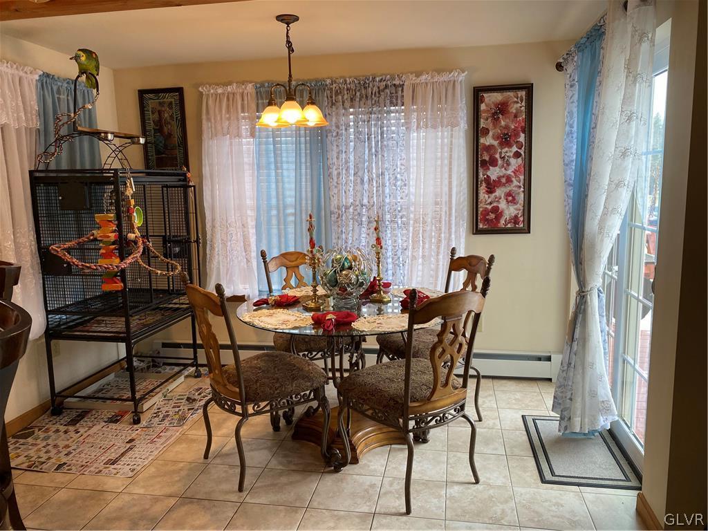 341 Chestnut Road Pocono Lake, PA 18347 - Photo 4 of 28 a view of a dining room with furniture and chandelier