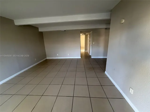 a view of an empty room and window