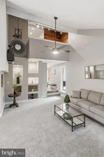 a living room with furniture and windows