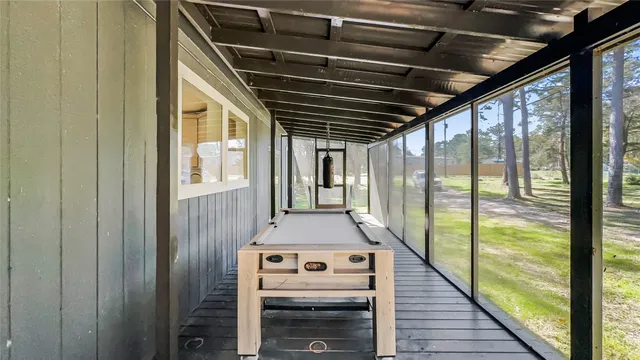 a view of a balcony with wooden floor