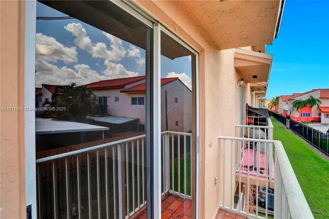 a balcony view with a garden view