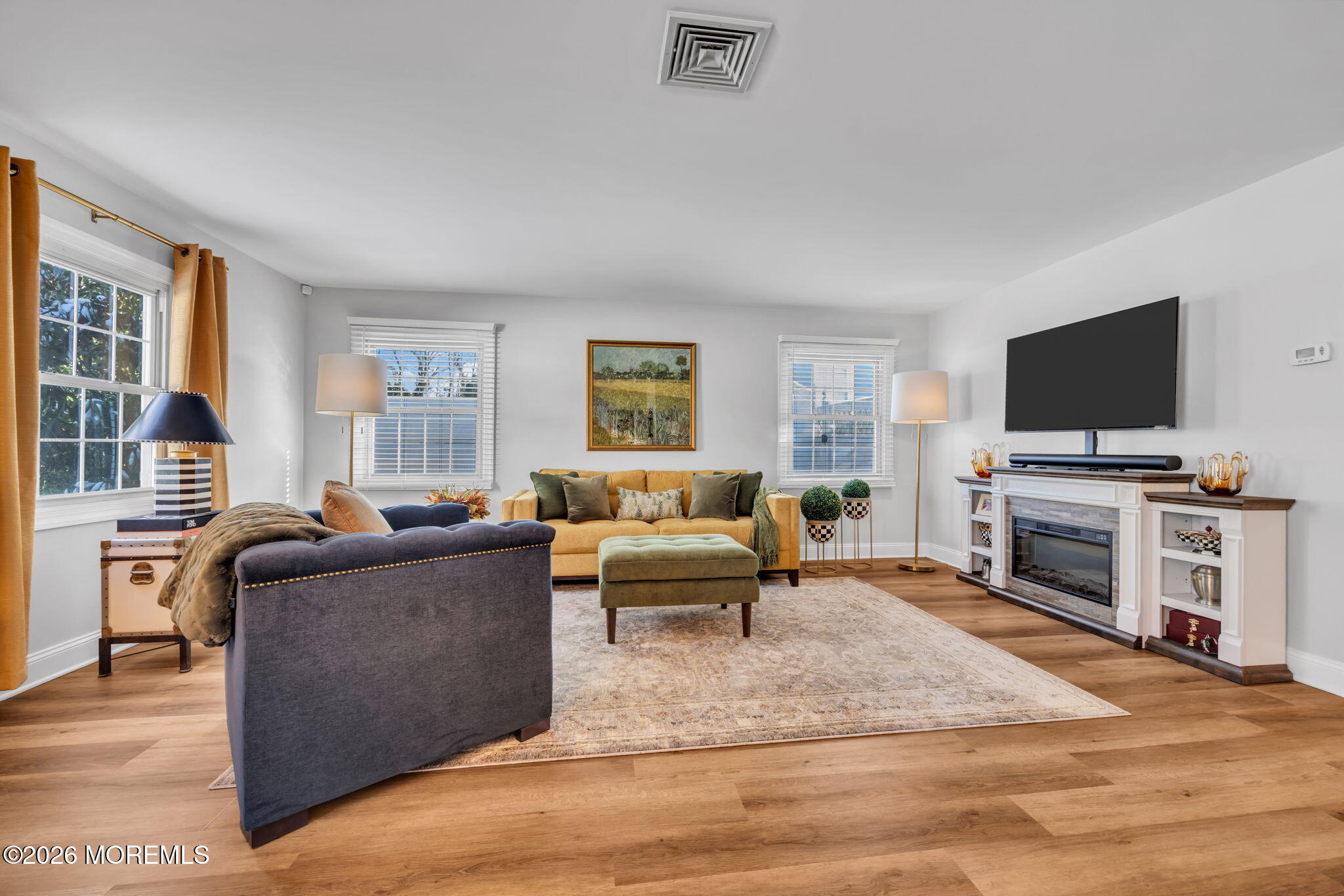 17 Idlebrook Lane Aberdeen, NJ 07747 - Photo 12 of 52 a living room with furniture and a flat screen tv