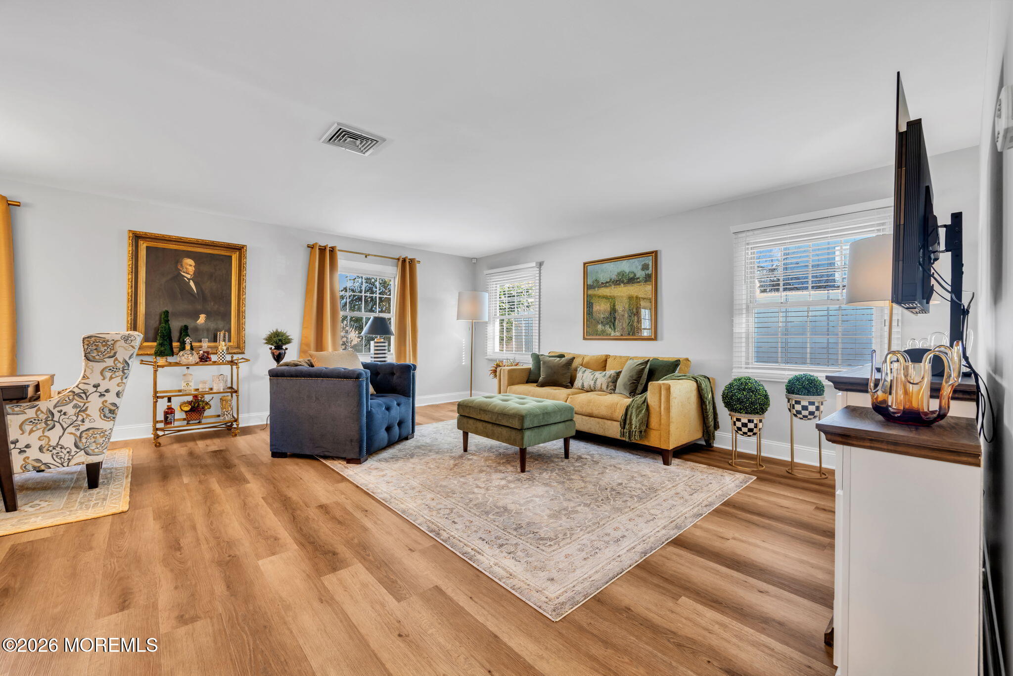 17 Idlebrook Lane Aberdeen, NJ 07747 - Photo 10 of 52 a living room with furniture large window and a flat screen tv