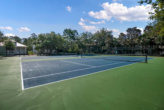 a view of an outdoor space and tennis court
