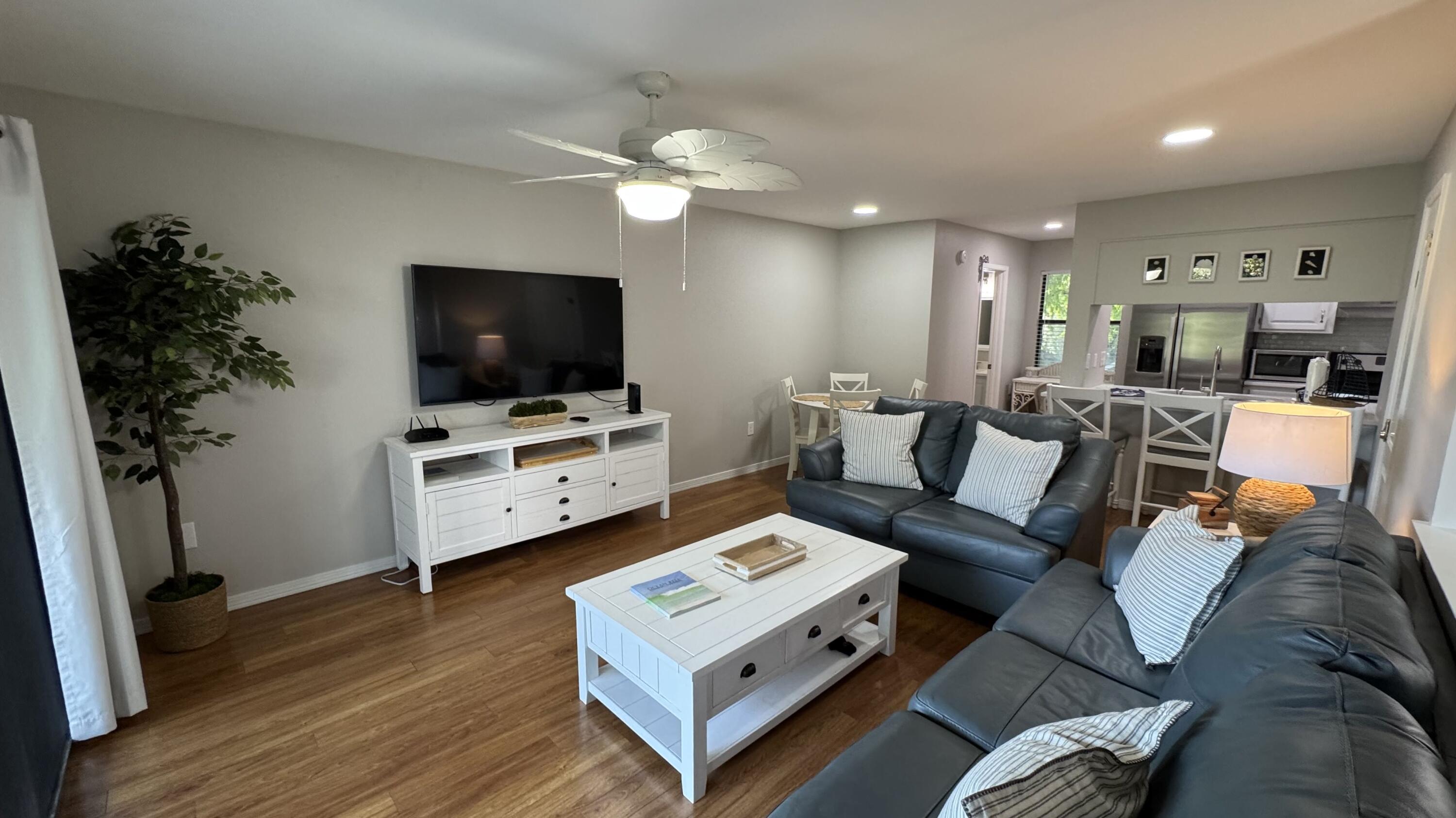 78 North Myrtle Drive, Unit 111 Santa Rosa Beach, FL 32459 - Photo 2 of 21 a living room with furniture and a flat screen tv