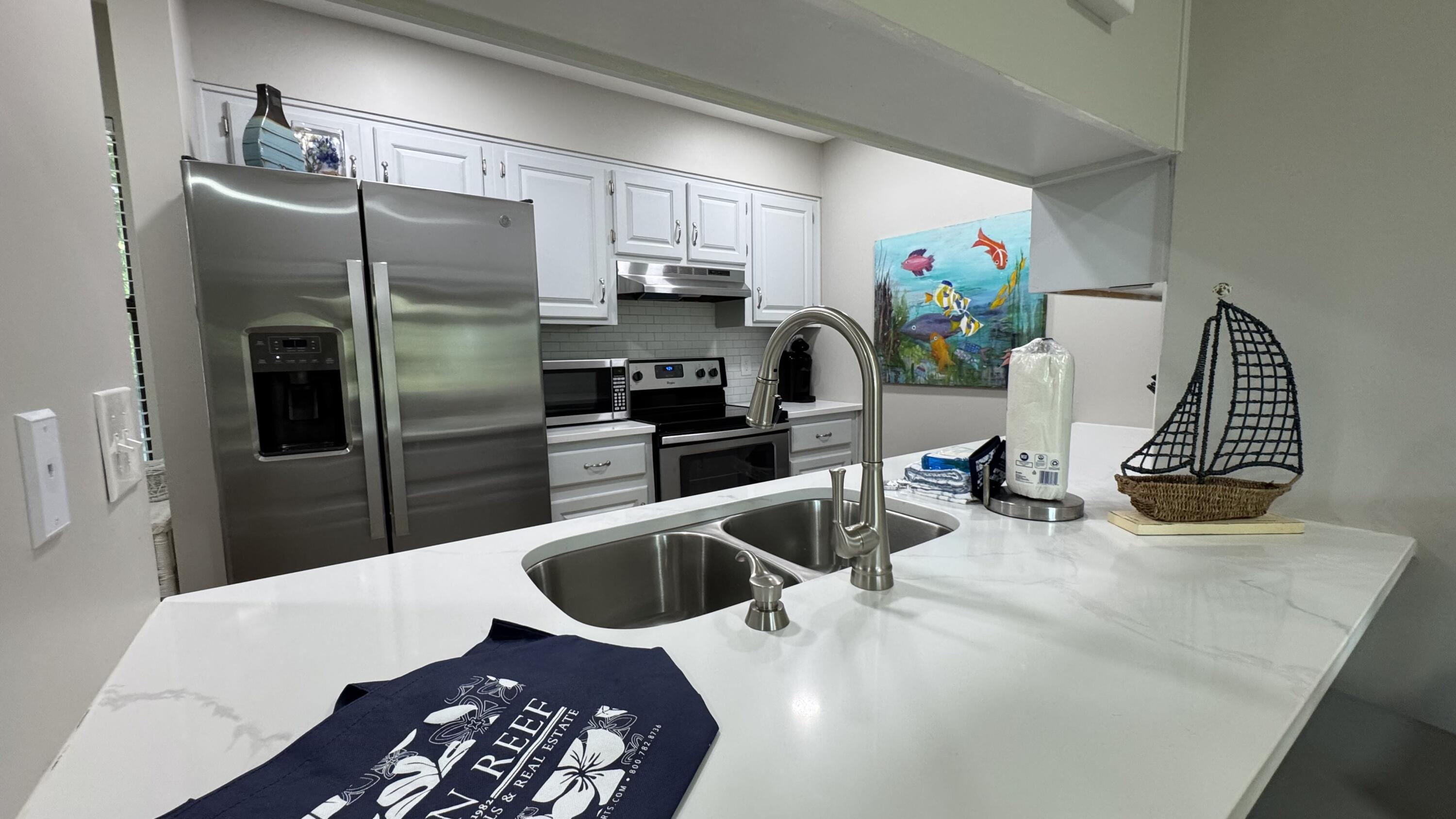 78 North Myrtle Drive, Unit 111 Santa Rosa Beach, FL 32459 - Photo 6 of 21 a kitchen with refrigerator and window