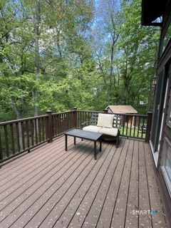 72 Pinnacle Road Ellington, CT 06029 - Photo 21 of 38 a wooden bench sitting on top of a wooden deck