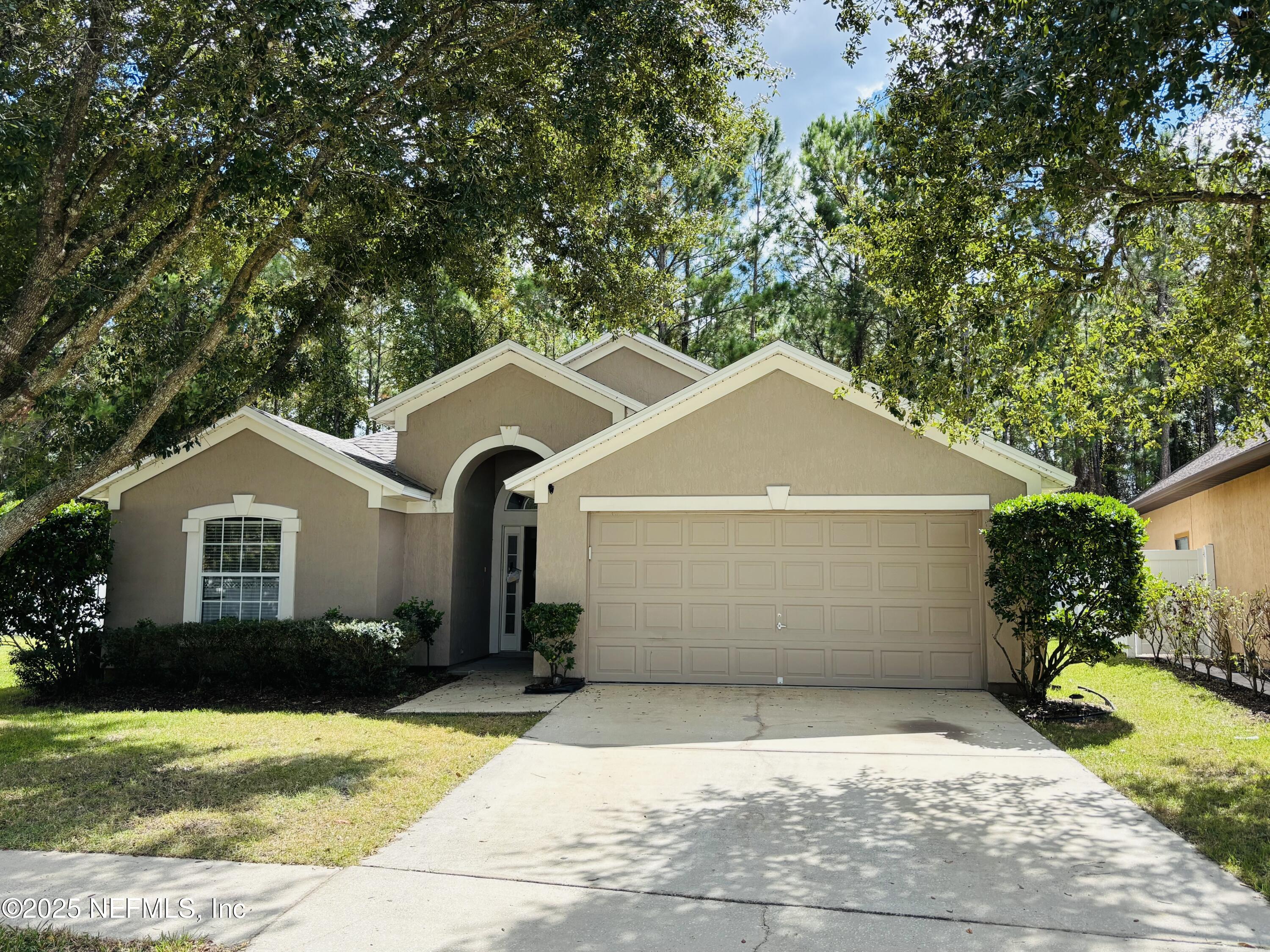 543 Longmill Lane Orange Park, FL 32065 - Photo 1 of 21 a front view of a house with a yard and garage