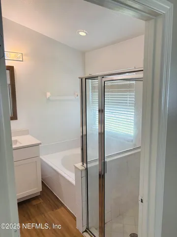 a bathroom with a bathtub and a sink
