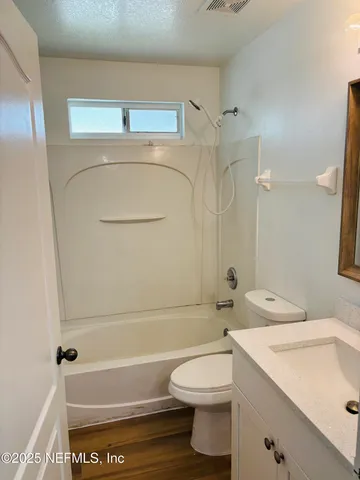 a bathroom with a toilet a sink and a bathtub