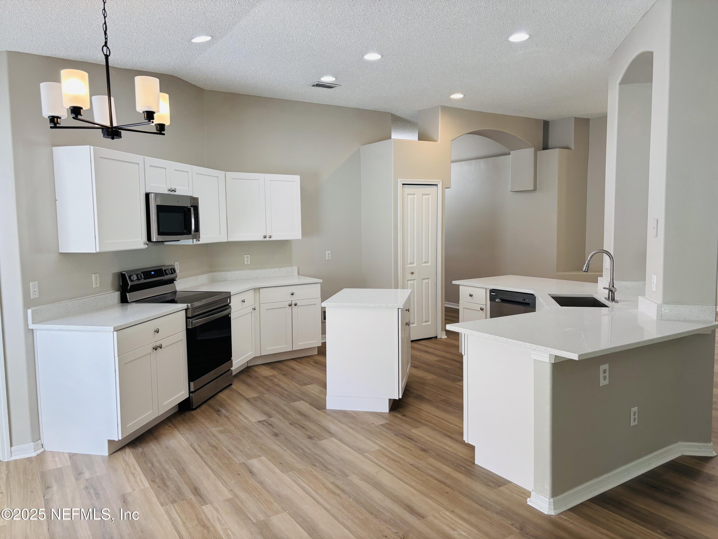 543 Longmill Lane Orange Park, FL 32065 - Photo 8 of 21 a kitchen with a sink stove and refrigerator