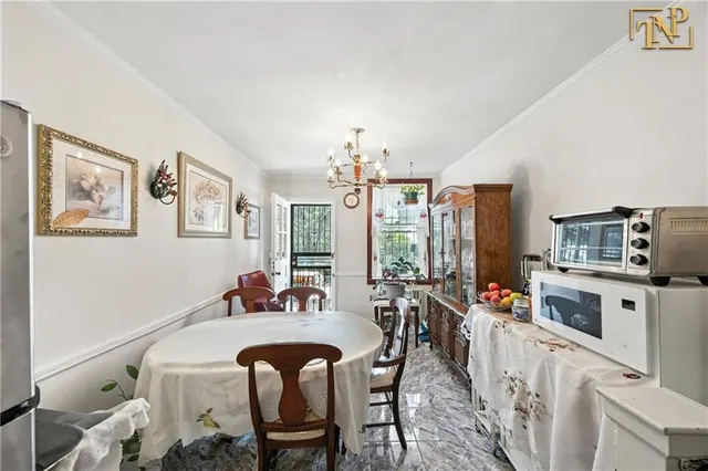 a view of a dining room with furniture window and outside view