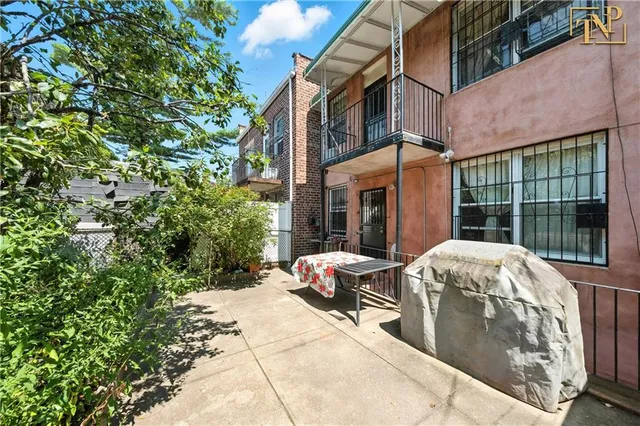 a front view of a building with garden
