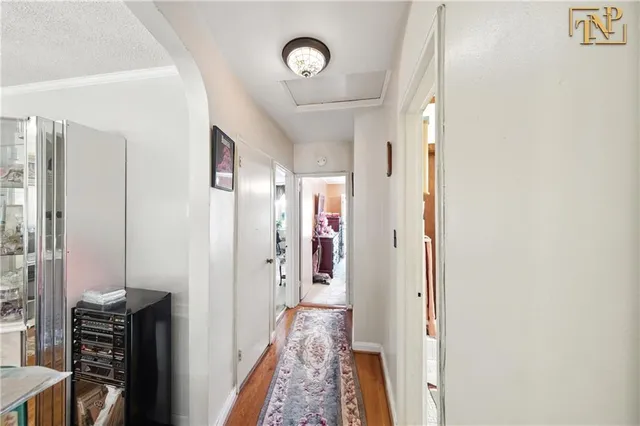 a view of a hallway with furniture