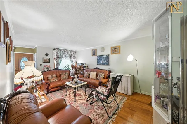 a living room with furniture and a lamp