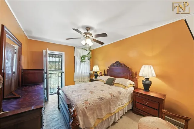 a spacious bedroom with a bed and a chandelier