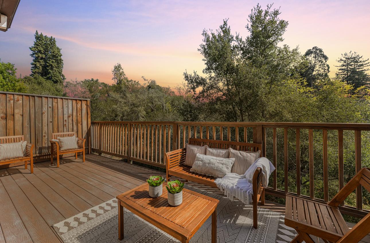 145 Atherton Loop Aptos, CA 95003 - Photo 11 of 47 a balcony with wooden floor table and chairs