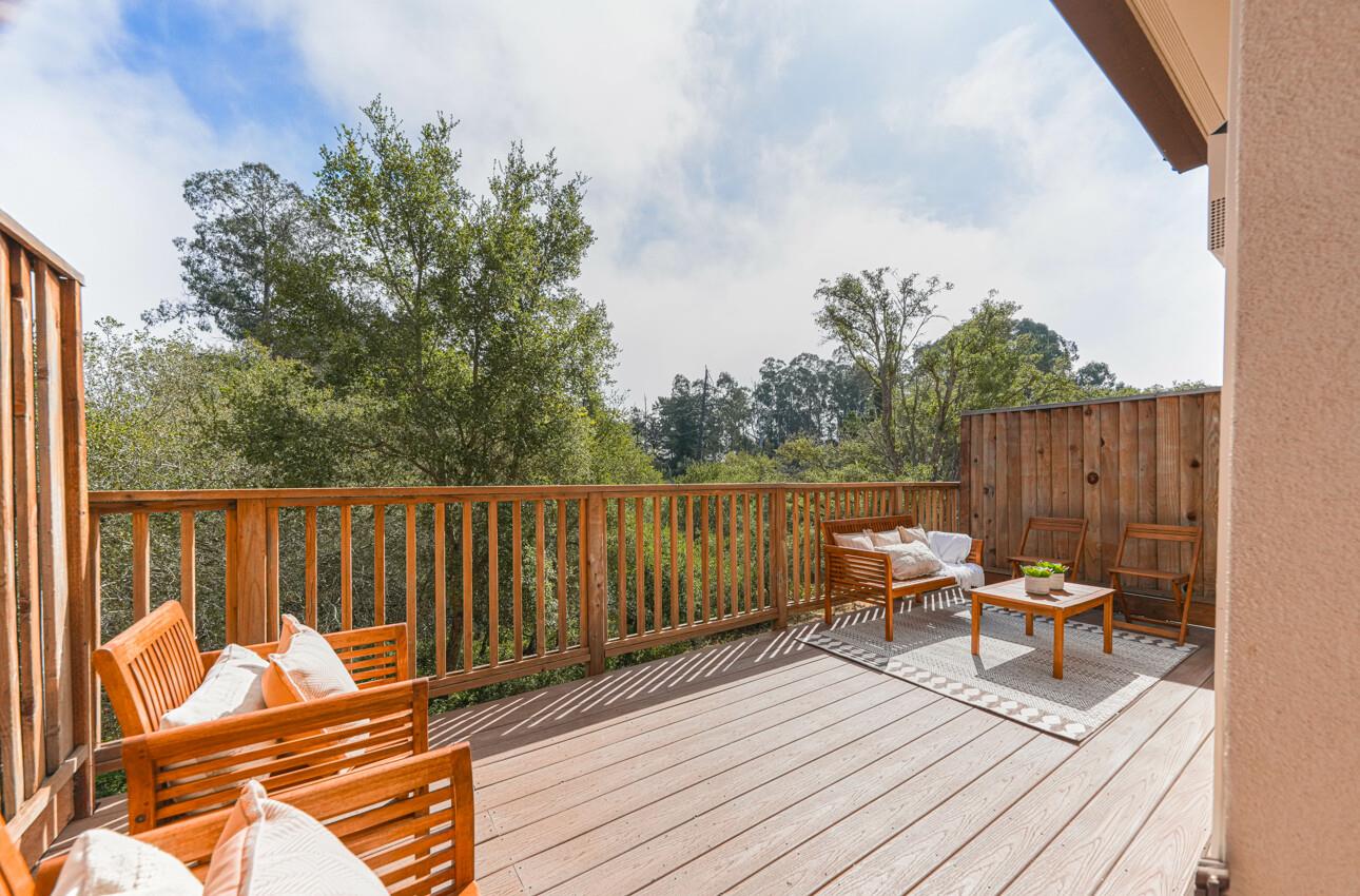 145 Atherton Loop Aptos, CA 95003 - Photo 19 of 47 a balcony with wooden floor and furniture