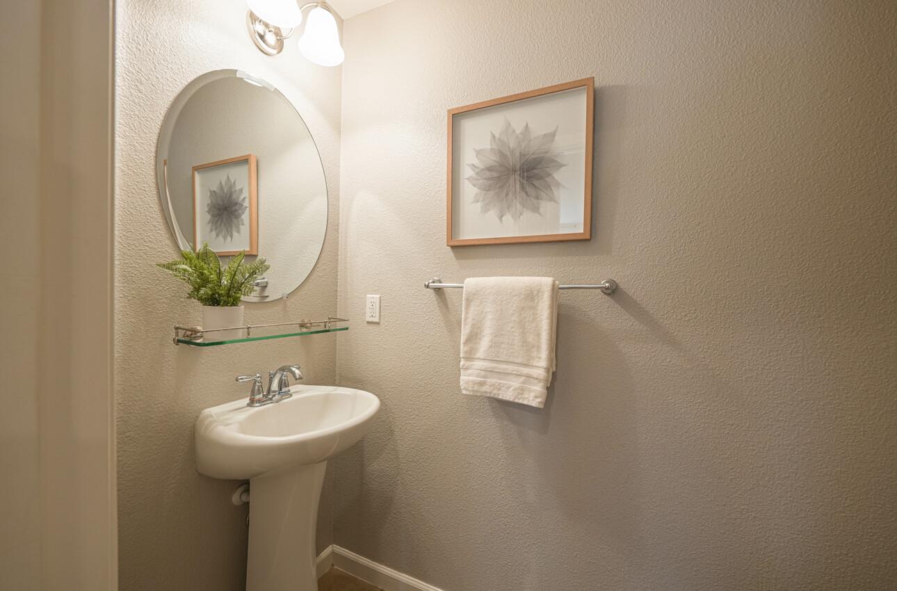 145 Atherton Loop Aptos, CA 95003 - Photo 21 of 47 a bathroom with a sink and mirror