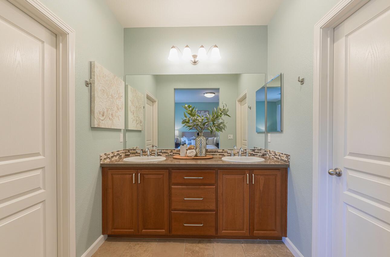 145 Atherton Loop Aptos, CA 95003 - Photo 26 of 47 a bathroom with a double vanity sink and a mirror