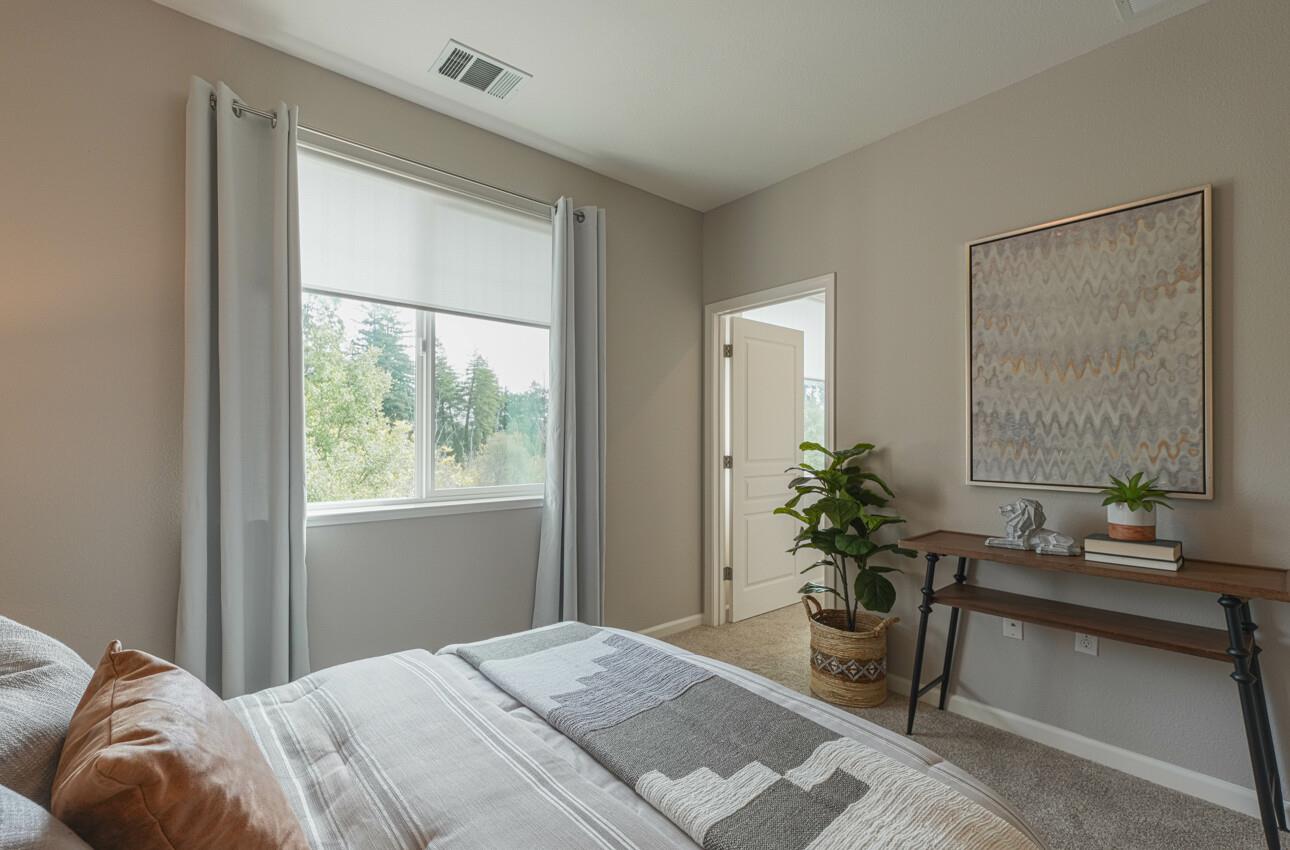 145 Atherton Loop Aptos, CA 95003 - Photo 31 of 47 a bedroom with a bed and a window
