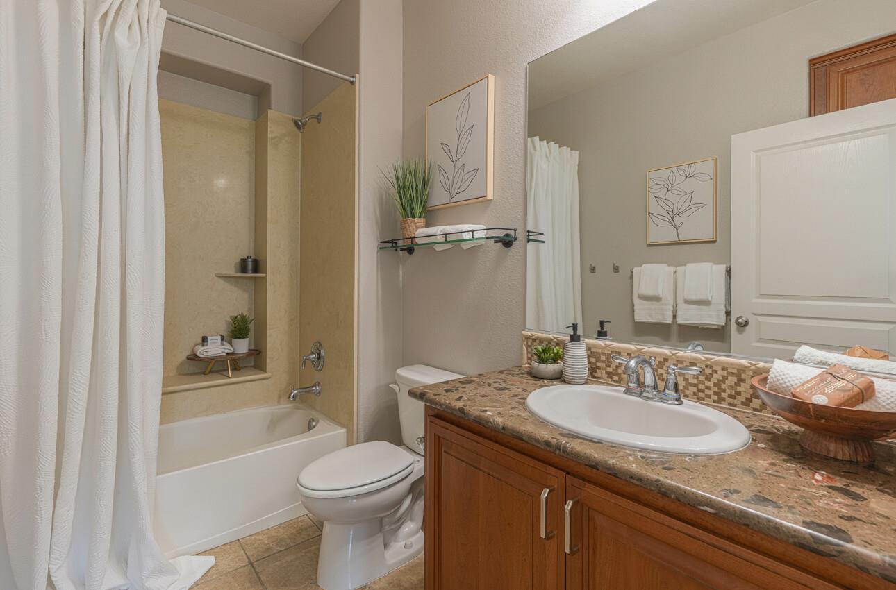 145 Atherton Loop Aptos, CA 95003 - Photo 32 of 47 a bathroom with a granite countertop sink toilet and shower