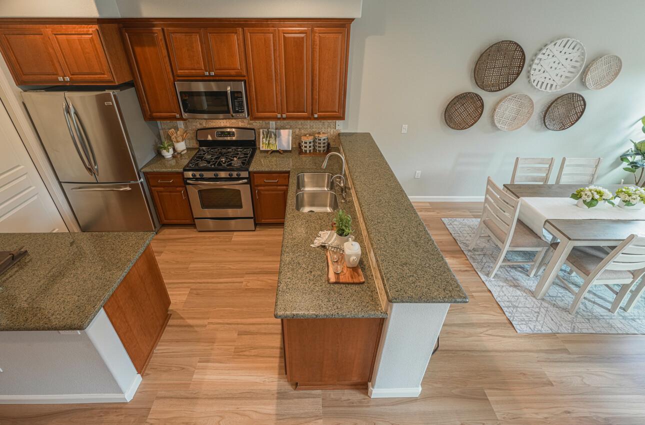 145 Atherton Loop Aptos, CA 95003 - Photo 36 of 47 a kitchen with wooden cabinets and stainless steel appliances