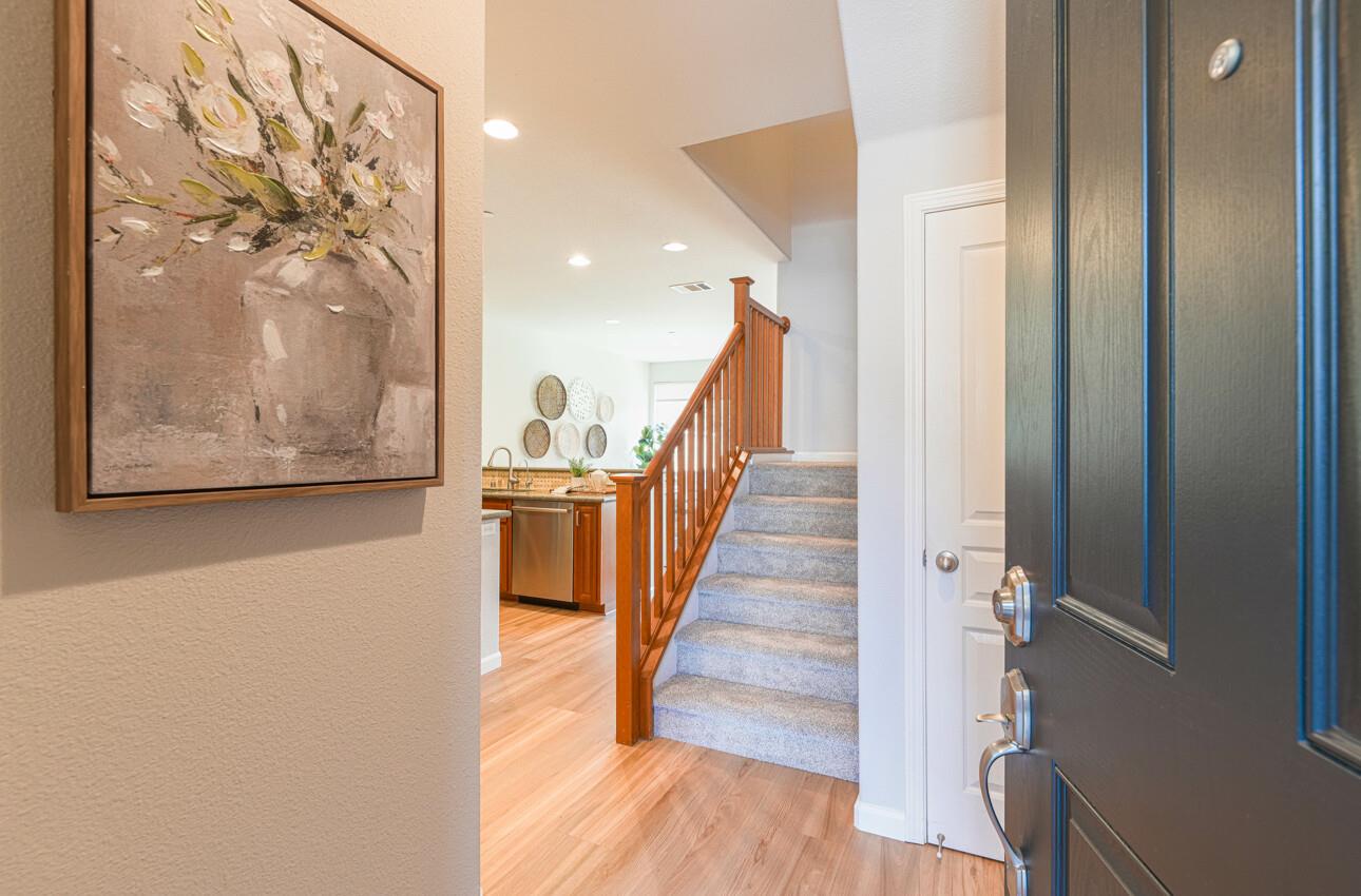 145 Atherton Loop Aptos, CA 95003 - Photo 5 of 47 a view of a hallway with wooden floor and staircase