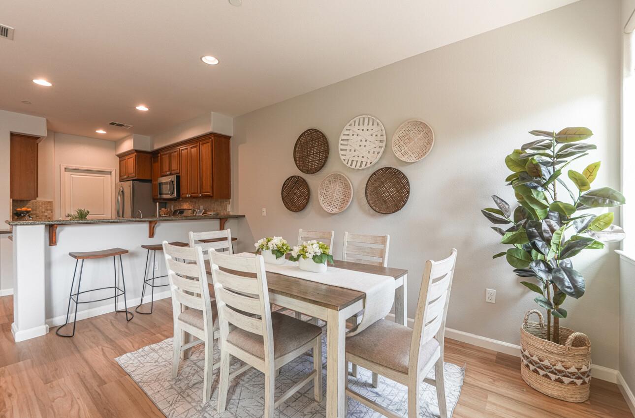 145 Atherton Loop Aptos, CA 95003 - Photo 7 of 47 a kitchen with a table and chairs in it